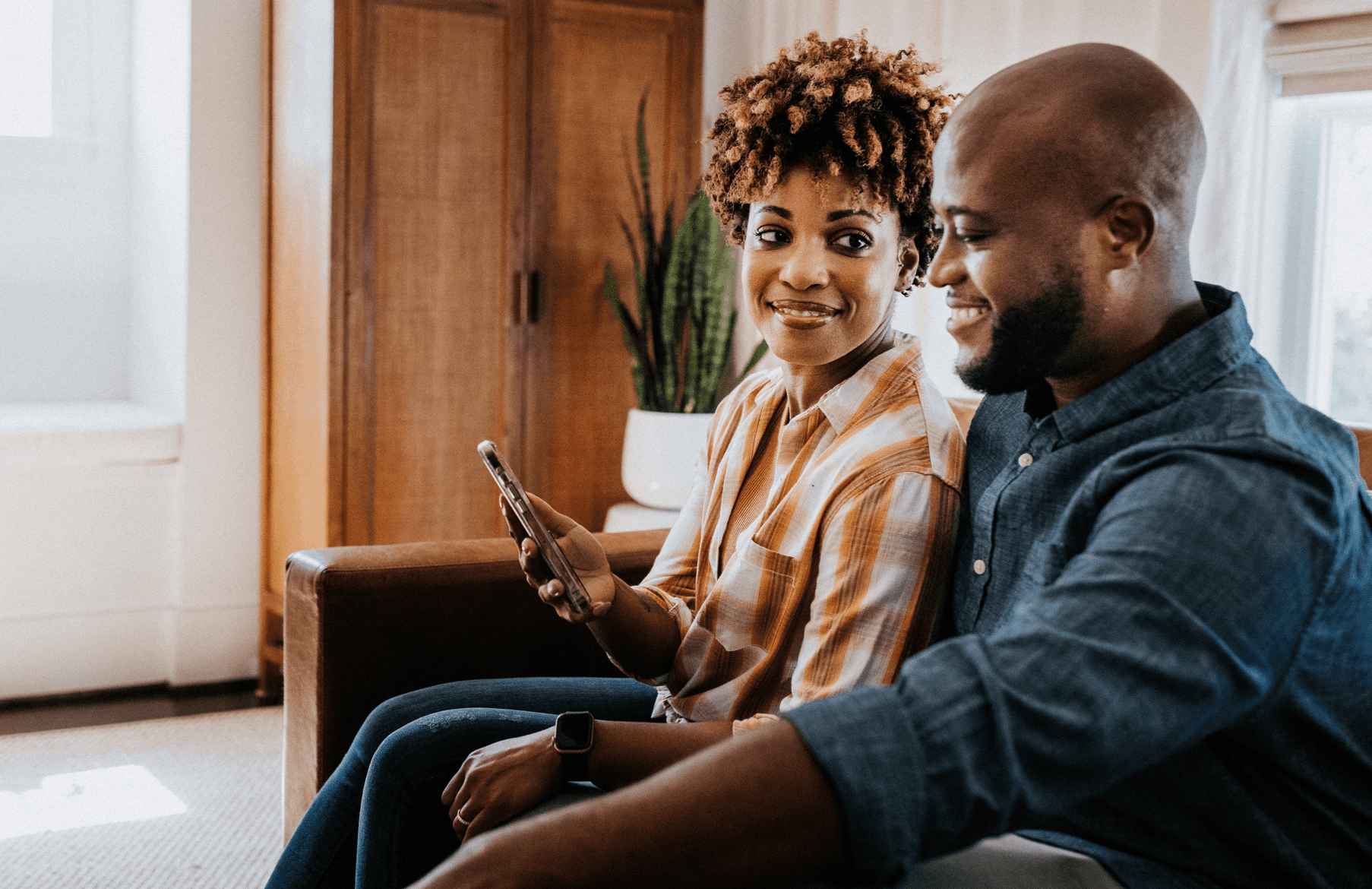 Couple looking at mobile phone