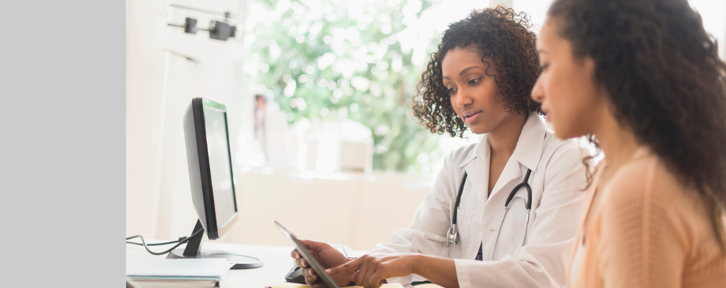 Young woman consulting with her doctor