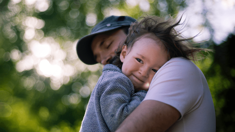 Father hugging daughter