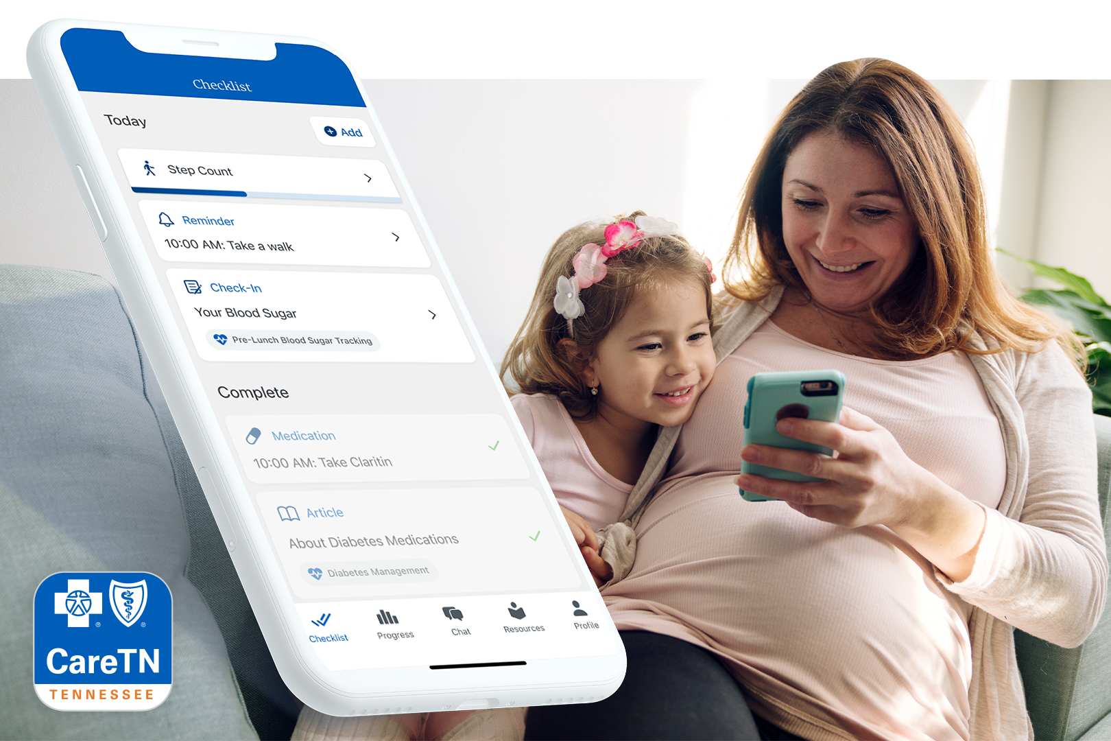Mom with daughter looking at CareTN app on her phone