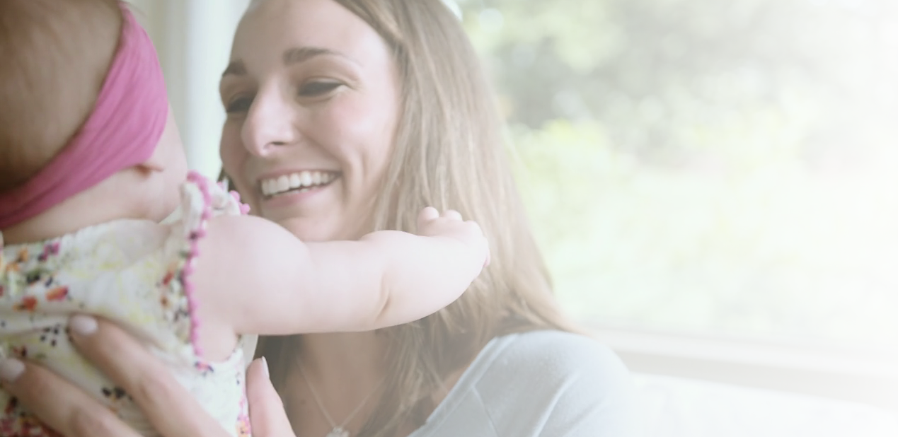 Mother smiling at baby