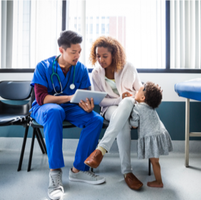 Doctor showing mother test results on a tablet