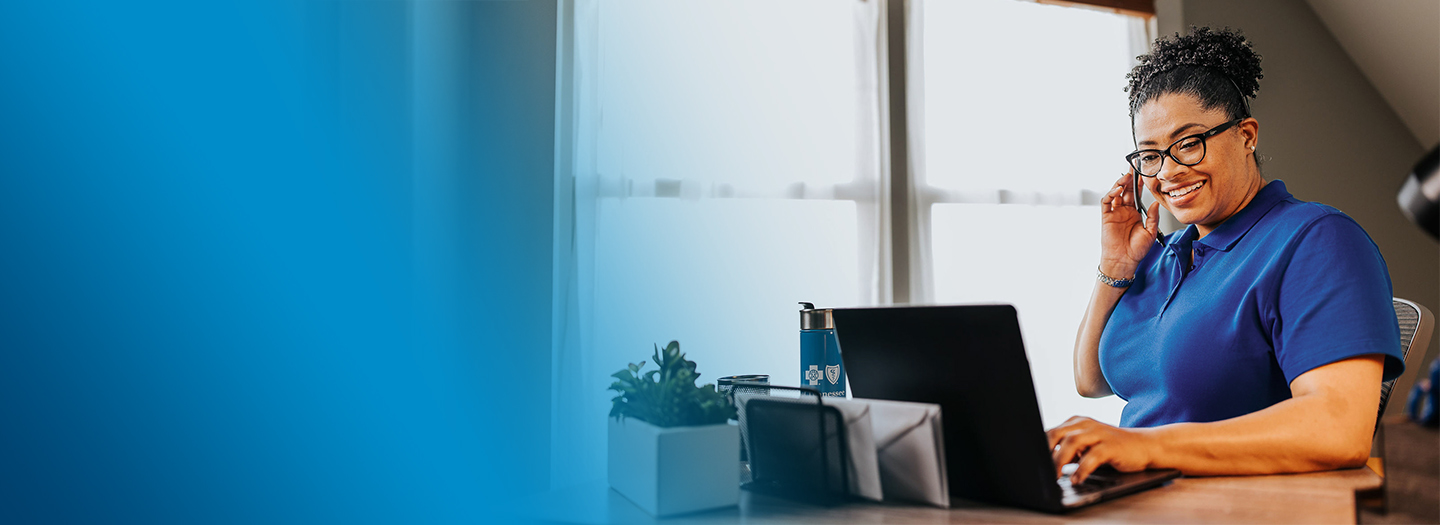 Woman working and talking through a headset.