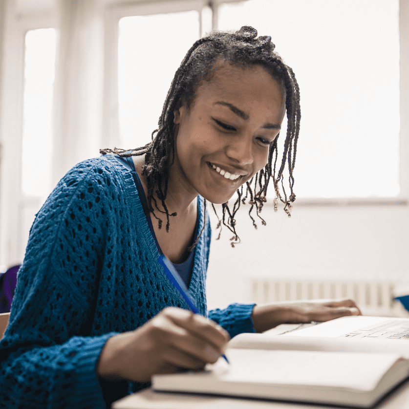 Woman writing in notebook