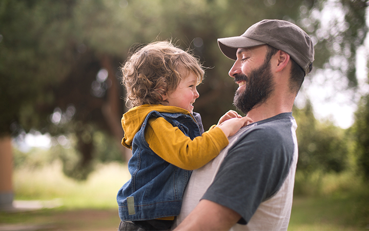 Father and son outside playing