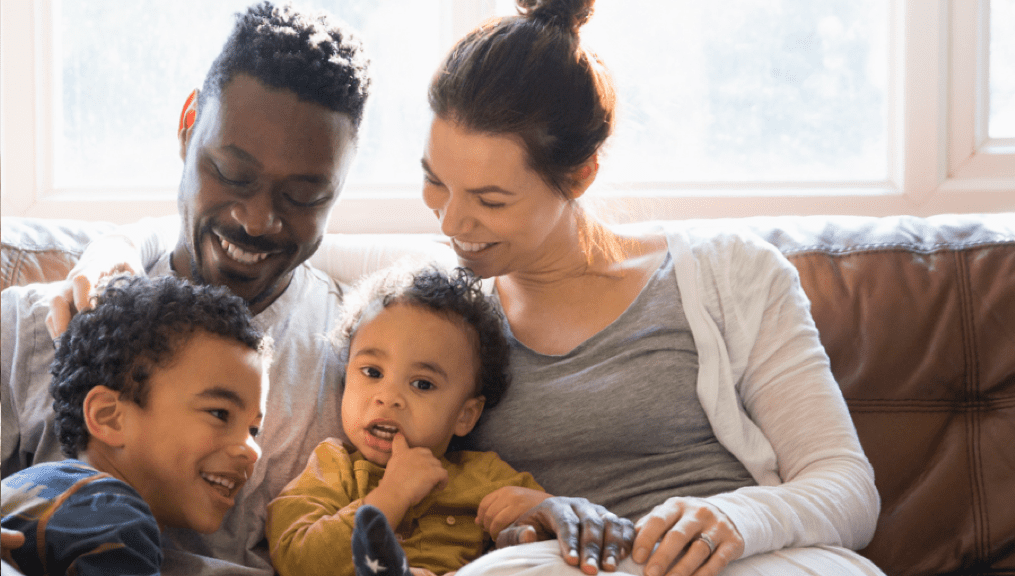 Woman and man holding children and talking | BCBS of Tennessee Woman and man holding children and talking | BCBS of Tennessee