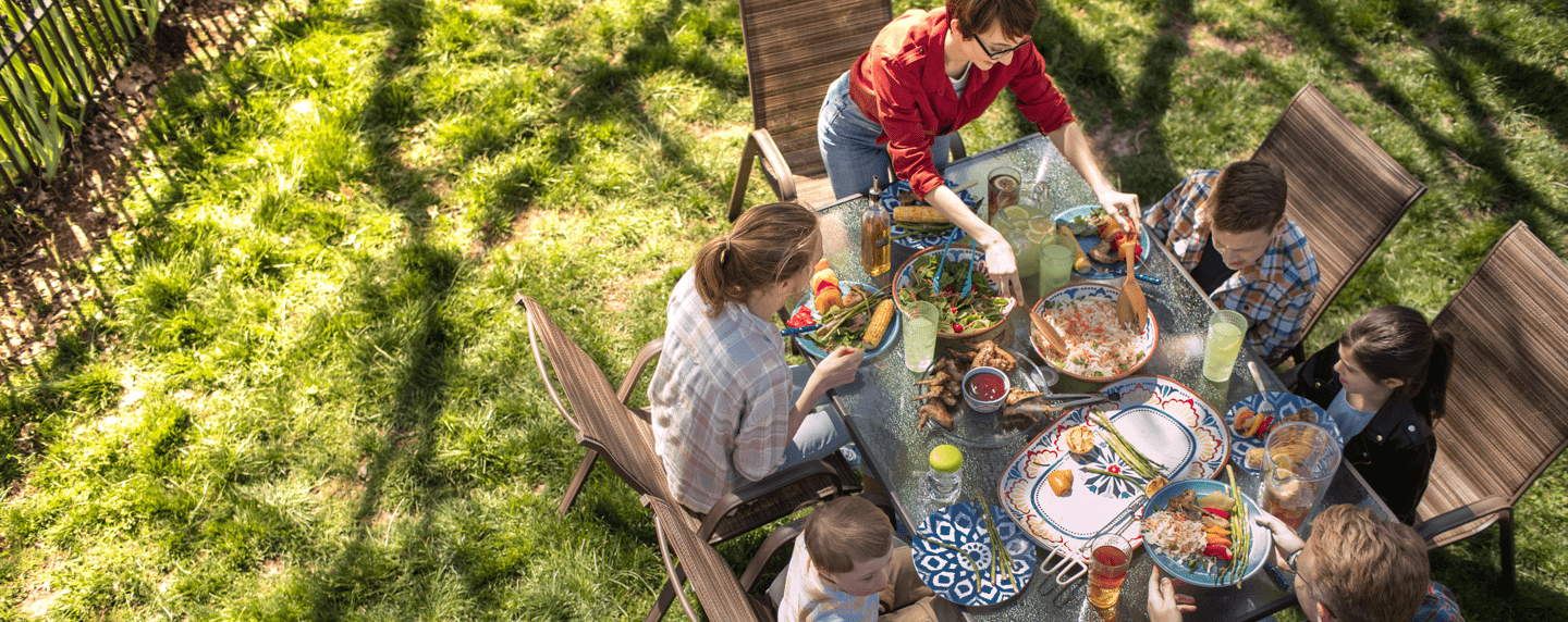 Group of people eating together outside