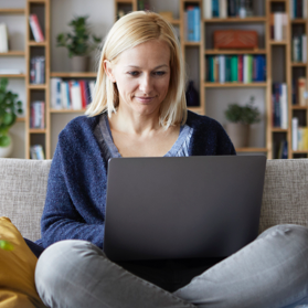 Woman managing her health savings account on laptop