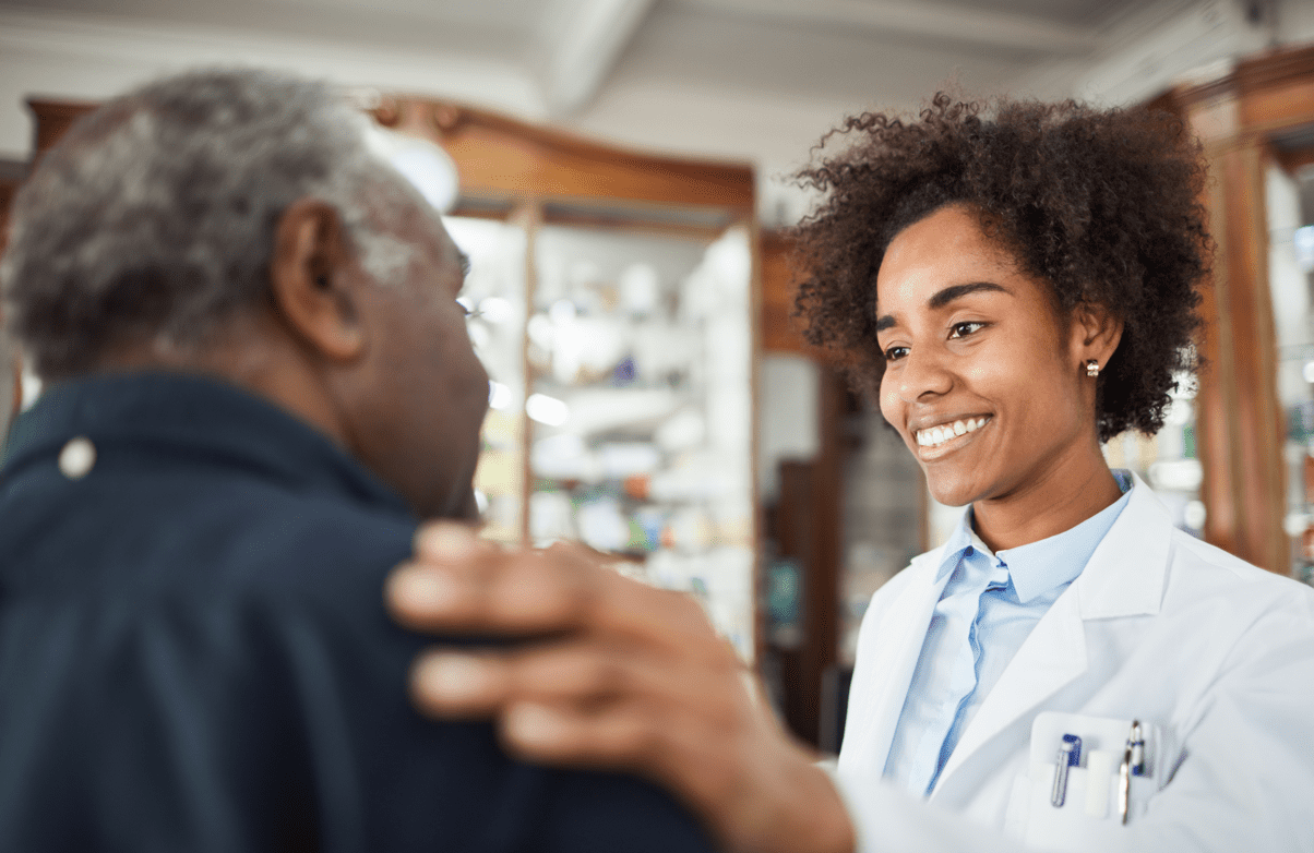 Young doctor smiling while speaking with their patient