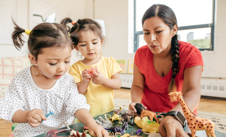 Mother playing with young daughters